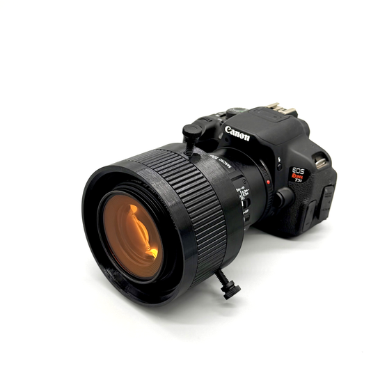 Avast Marine Porthole Studio for DSLR shown on a Canon EOS RebelT5i. 3D-printed underwater coral and fish photography gear. Black camera lens with accessories on a white background. 